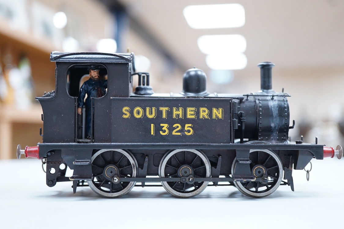 An 0 gauge scratch built model railway locomotive by John Worsley, a Southern Railway P class 0-6-0T, 1325, a detailed model with opening smoke box door showing the details of the blast pipe and boiler tube ends, sprung